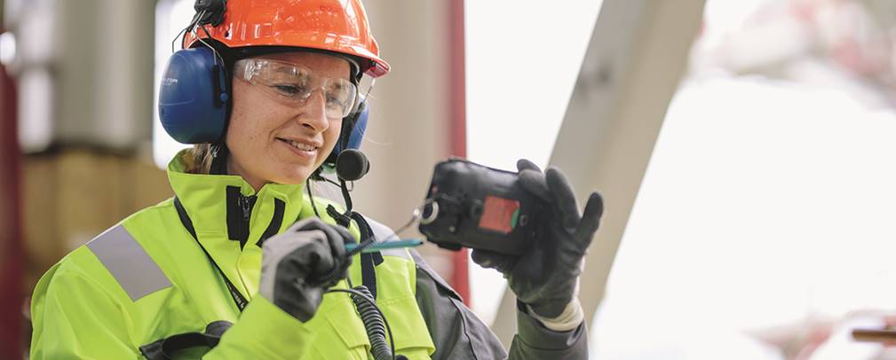 A picture containing wearing, hat, jacket, yellow

Description automatically generated