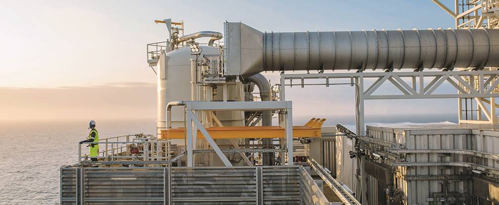 A large building with a metal fence

Description automatically generated