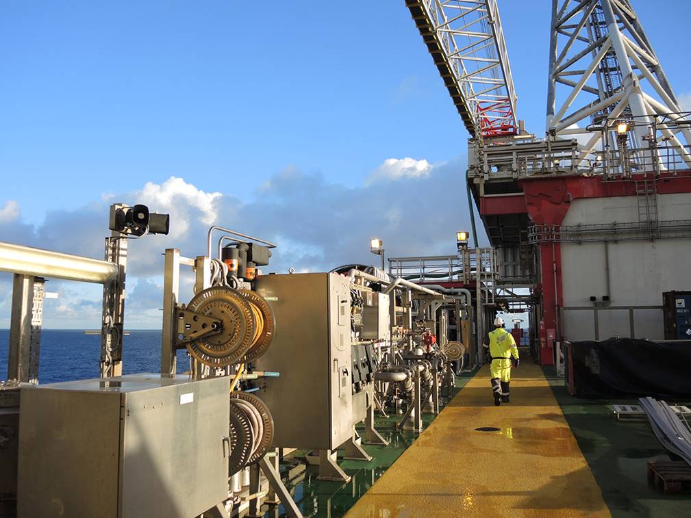 A picture containing building, sitting, large, boat

Description automatically generated