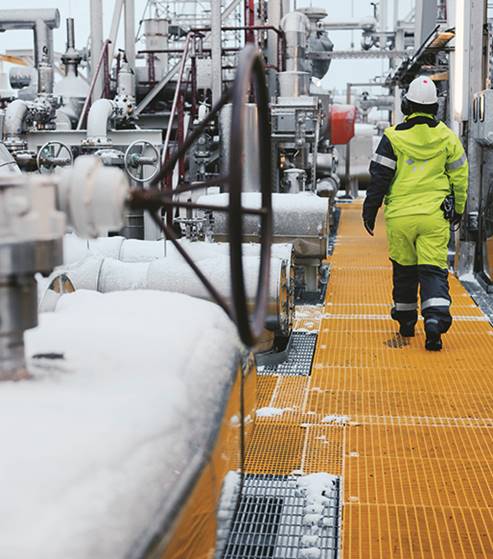 A group of people walking in the snow

Description automatically generated