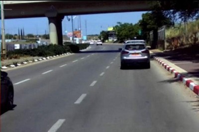 A car driving on a road

Description automatically generated